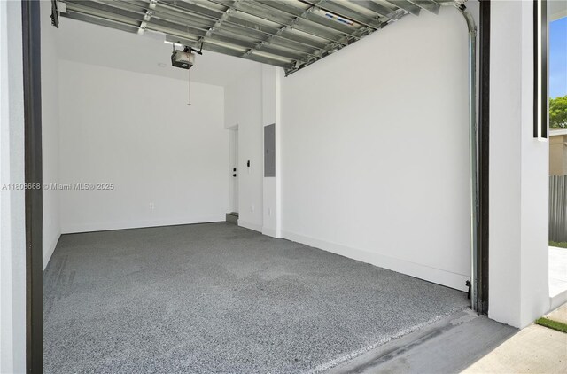 2839 SW 25th St, Miami, FL 33133 - garage with electric panel and a garage door opener