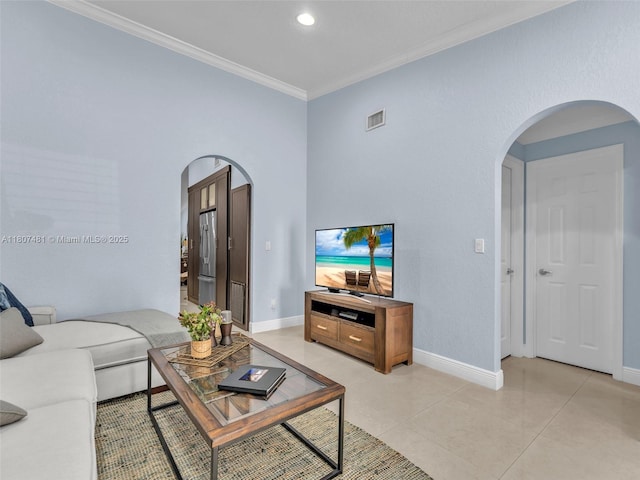 5650 W 21st Ave, Hialeah, FL 33016 - living room featuring arched walkways, ornamental molding, baseboards, light tile patterned floors, and recessed lighting