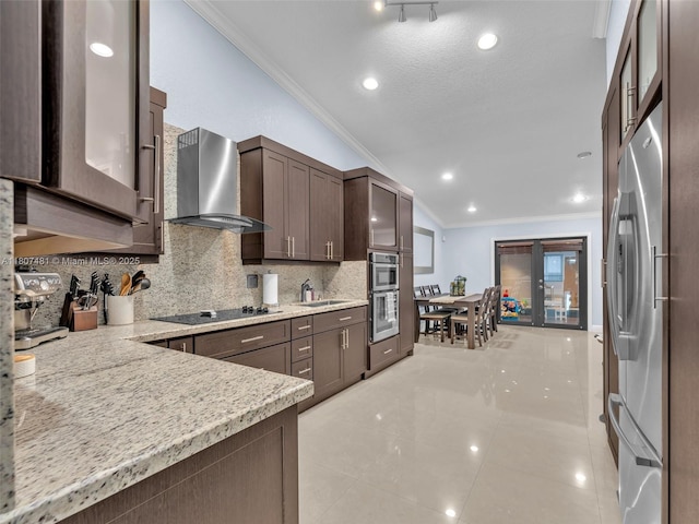5650 W 21st Ave, Hialeah, FL 33016 - kitchen featuring wall chimney exhaust hood, ornamental molding, appliances with stainless steel finishes, tasteful backsplash, and a sink