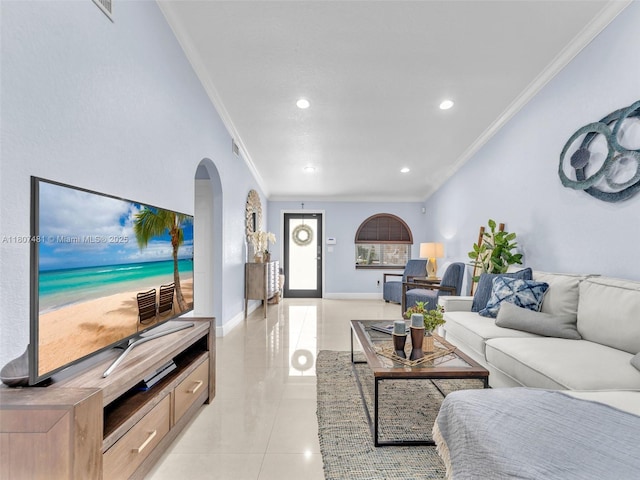 5650 W 21st Ave, Hialeah, FL 33016 - living area featuring ornamental molding, arched walkways, recessed lighting, light tile patterned floors, and baseboards