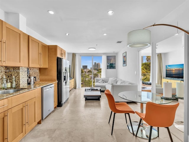 945 Michigan Ave Unit 8, Miami Beach, FL 33139 - kitchen featuring stainless steel appliances, plenty of natural light, a sink, tasteful backsplash, and recessed lighting