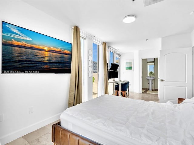 945 Michigan Ave Unit 8, Miami Beach, FL 33139 - bedroom featuring a sink, baseboards, and light tile patterned floors