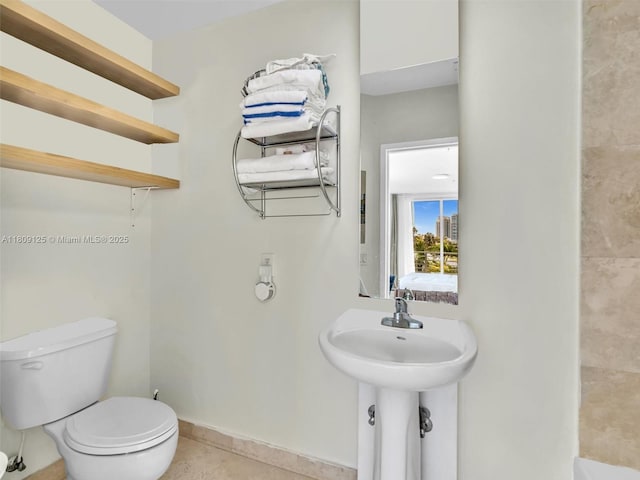 945 Michigan Ave Unit 8, Miami Beach, FL 33139 - full bath featuring toilet, tile patterned flooring, and baseboards