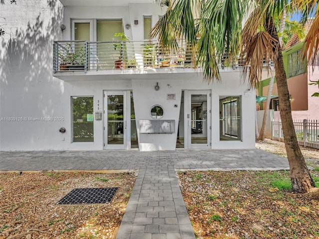 945 Michigan Ave Unit 8, Miami Beach, FL 33139 - doorway to property with a balcony and stucco siding