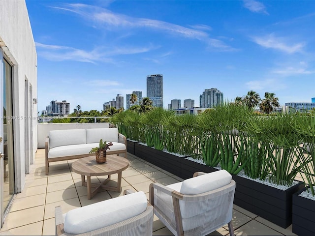 945 Michigan Ave Unit 8, Miami Beach, FL 33139 - patio / terrace featuring a view of skyline and outdoor lounge area
