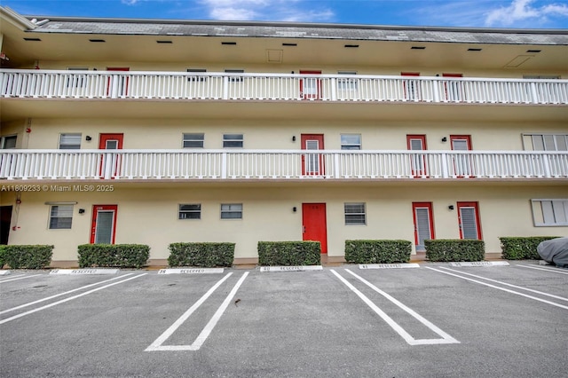 4441 NW 16th St Unit J108, Lauderhill, FL 33313 - view of building exterior featuring uncovered parking