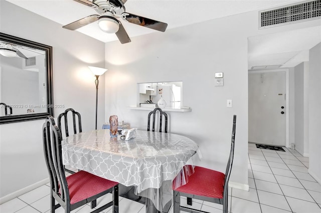 4441 NW 16th St Unit J108, Lauderhill, FL 33313 - dining area featuring ceiling fan, light tile patterned flooring, baseboards, and attic access