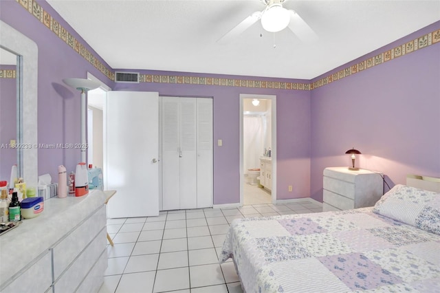 4441 NW 16th St Unit J108, Lauderhill, FL 33313 - bedroom with light tile patterned flooring, a ceiling fan, and ensuite bathroom