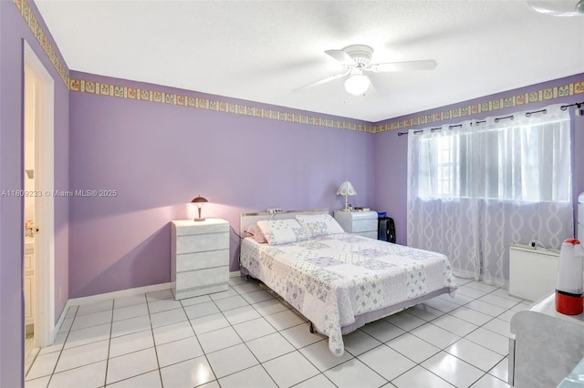 4441 NW 16th St Unit J108, Lauderhill, FL 33313 - bedroom with light tile patterned floors, ceiling fan, and baseboards