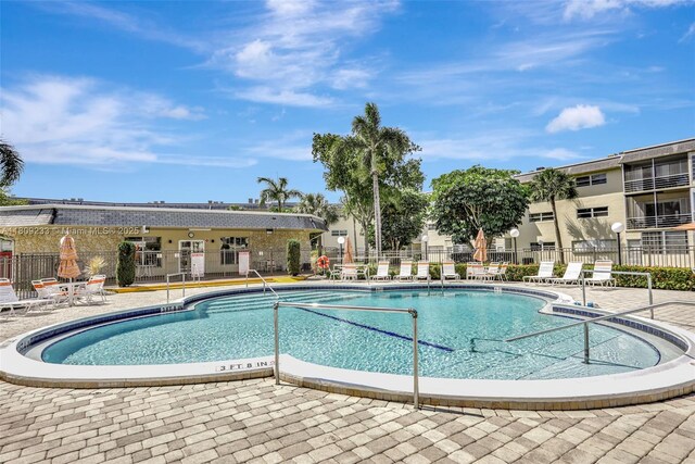4441 NW 16th St Unit J108, Lauderhill, FL 33313 - community pool featuring a patio