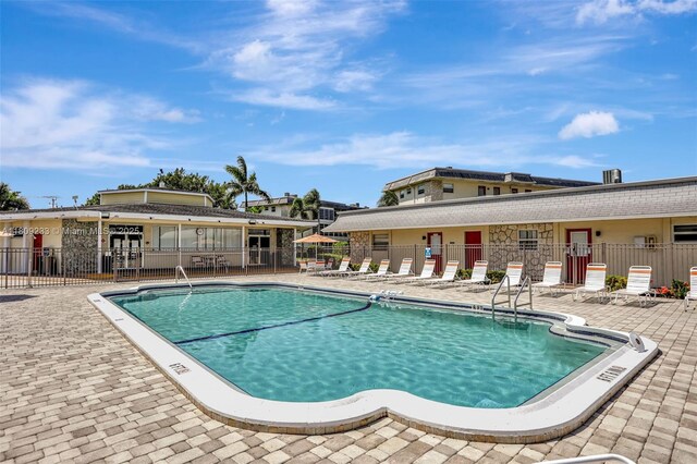 4441 NW 16th St Unit J108, Lauderhill, FL 33313 - community pool featuring a patio area