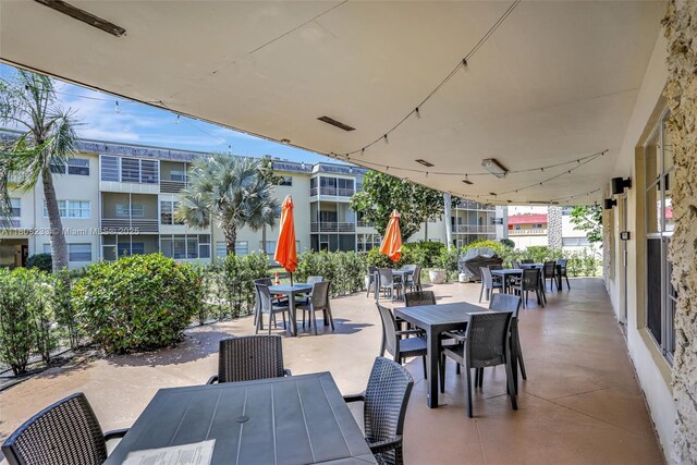 4441 NW 16th St Unit J108, Lauderhill, FL 33313 - view of patio featuring outdoor dining area