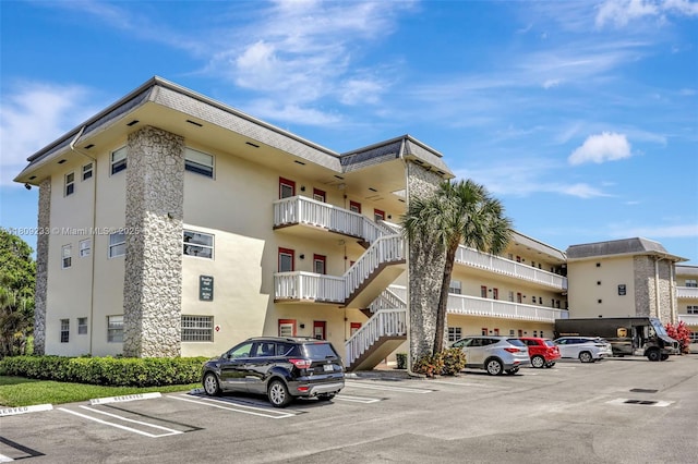 4441 NW 16th St Unit J108, Lauderhill, FL 33313 - view of apartment building / complex with uncovered parking and stairs