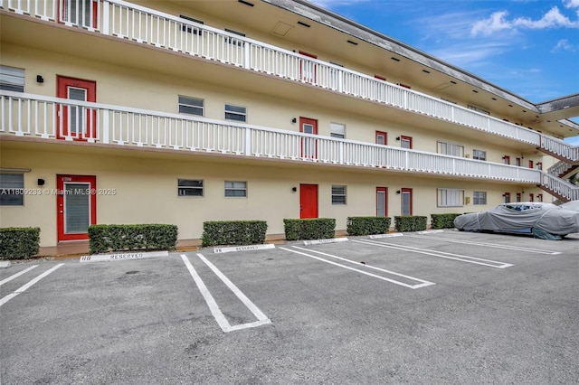 4441 NW 16th St Unit J108, Lauderhill, FL 33313 - view of property featuring uncovered parking