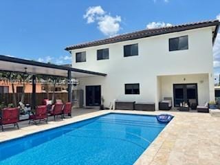3801 SW 149th Ave, Miami, FL 33185 - back of property with a patio area and stucco siding