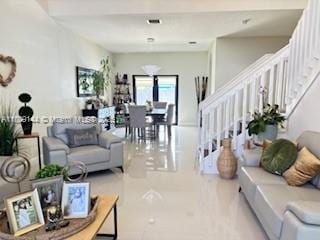 3801 SW 149th Ave, Miami, FL 33185 - tiled living area featuring stairway