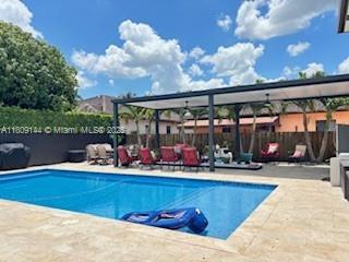 3801 SW 149th Ave, Miami, FL 33185 - view of swimming pool featuring a patio area