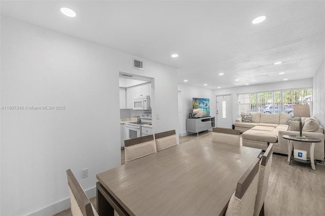 1356 Pelican Ct, Homestead, FL 33035 - dining area featuring recessed lighting, light wood-style floors, and baseboards