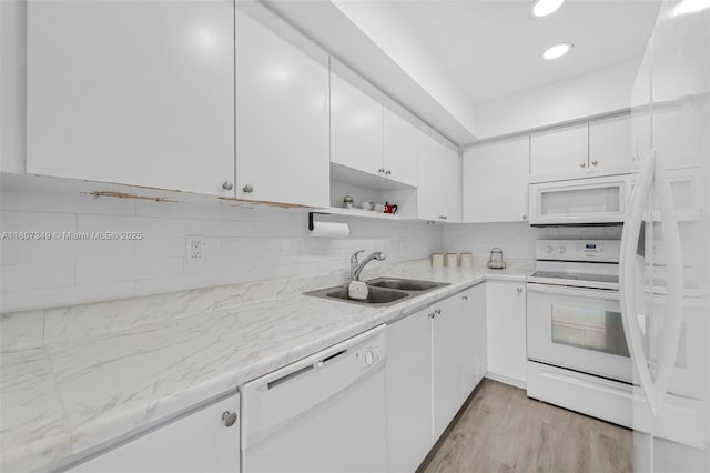 1356 Pelican Ct, Homestead, FL 33035 - kitchen featuring white appliances, a sink, white cabinetry, decorative backsplash, and recessed lighting