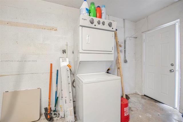 1356 Pelican Ct, Homestead, FL 33035 - laundry area with stacked washer / dryer and concrete block wall