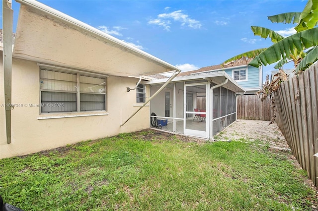 1356 Pelican Ct, Homestead, FL 33035 - rear view of property featuring stucco siding and a sunroom