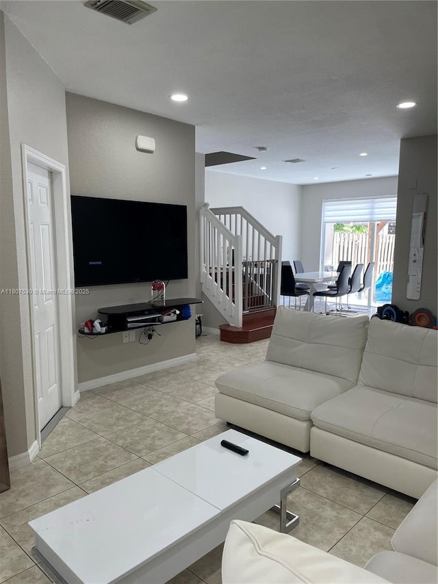 11921 SW 153rd Pl, Miami, FL 33196 - living room featuring light tile patterned floors, recessed lighting, baseboards, and stairway