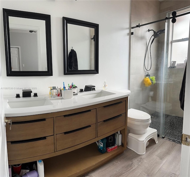 11921 SW 153rd Pl, Miami, FL 33196 - bathroom with toilet, double vanity, a shower stall, and wood finished floors
