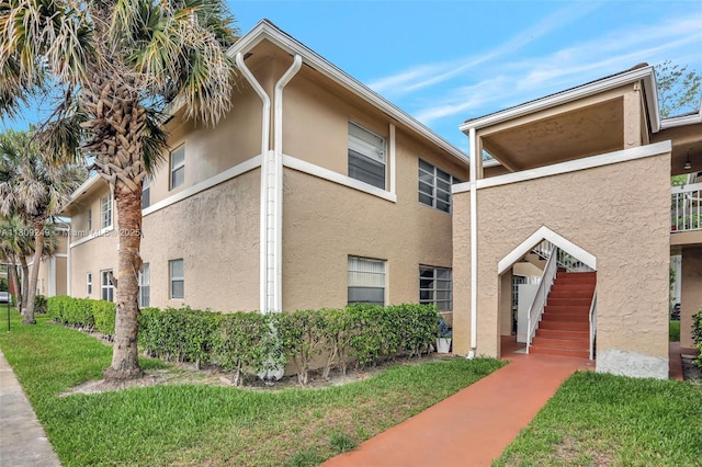 826 Twin Lakes Dr Unit 18-D, Coral Springs, FL 33071 - view of side of property featuring stucco siding and stairs