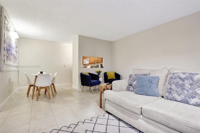 826 Twin Lakes Dr Unit 18-D, Coral Springs, FL 33071 - living area featuring light tile patterned floors and baseboards