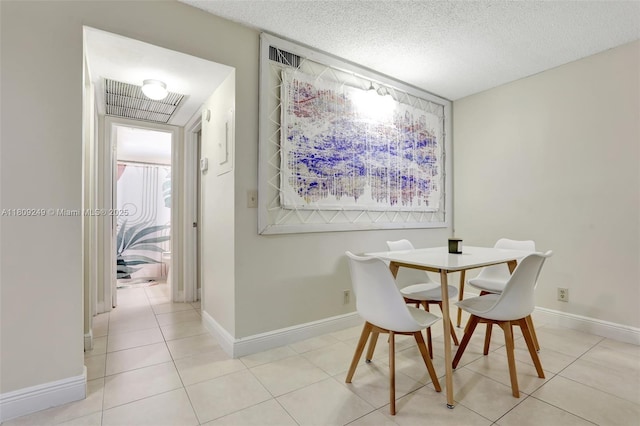 826 Twin Lakes Dr Unit 18-D, Coral Springs, FL 33071 - dining space featuring light tile patterned floors, a textured ceiling, and plenty of natural light