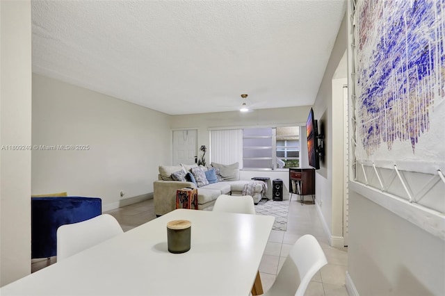 826 Twin Lakes Dr Unit 18-D, Coral Springs, FL 33071 - dining area with light tile patterned flooring and a textured ceiling