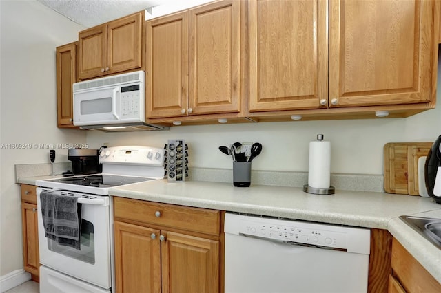 826 Twin Lakes Dr Unit 18-D, Coral Springs, FL 33071 - kitchen with white appliances and light countertops