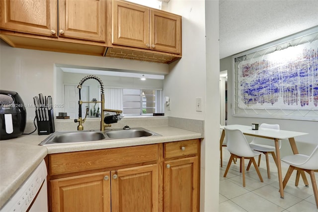 826 Twin Lakes Dr Unit 18-D, Coral Springs, FL 33071 - kitchen featuring dishwasher, light tile patterned floors, light countertops, and brown cabinets