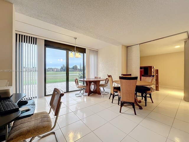 4545 Luxemburg Ct Unit 103, Lake Worth, FL 33467 - dining area featuring a textured ceiling and light tile patterned floors