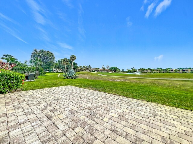 4545 Luxemburg Ct Unit 103, Lake Worth, FL 33467 - view of community with a water view, a yard, and view of golf course
