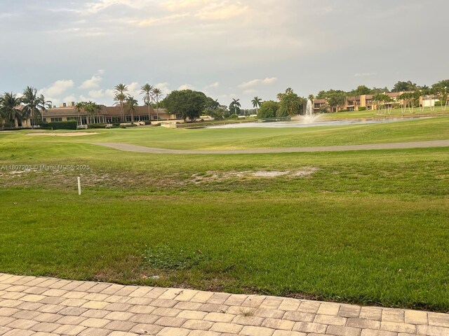 4545 Luxemburg Ct Unit 103, Lake Worth, FL 33467 - surrounding community featuring a water view, a lawn, and golf course view