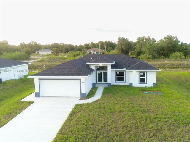 1023 Pilgrim, Lehigh Acres, FL 33974 - view of front of property featuring an attached garage, stucco siding, a front lawn, driveway, and roof with shingles