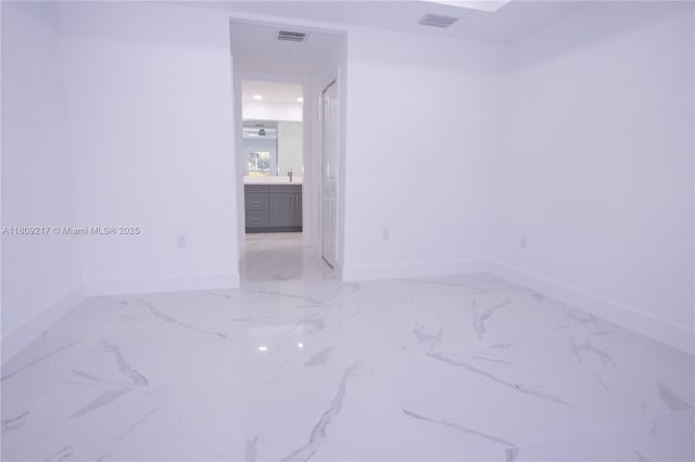 1023 Pilgrim, Lehigh Acres, FL 33974 - spare room featuring baseboards and marble finish floors