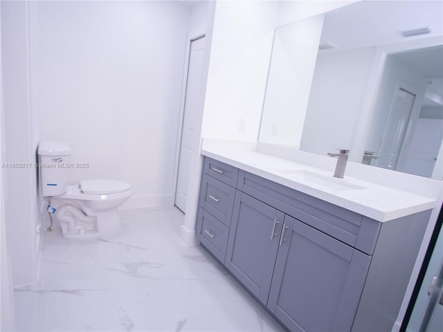 1023 Pilgrim, Lehigh Acres, FL 33974 - bathroom with vanity, marble look tiles, baseboards, and toilet