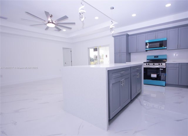 1023 Pilgrim, Lehigh Acres, FL 33974 - kitchen with stainless steel appliances, light marble finish floors, recessed lighting, and pendant lighting