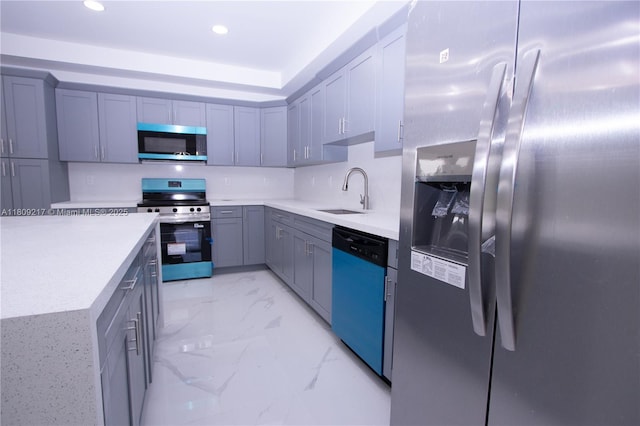 1023 Pilgrim, Lehigh Acres, FL 33974 - kitchen featuring stainless steel appliances, a sink, light countertops, light marble finish floors, and recessed lighting