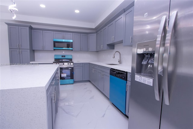 1023 Pilgrim, Lehigh Acres, FL 33974 - kitchen with appliances with stainless steel finishes, a sink, light marble finish flooring, light countertops, and recessed lighting