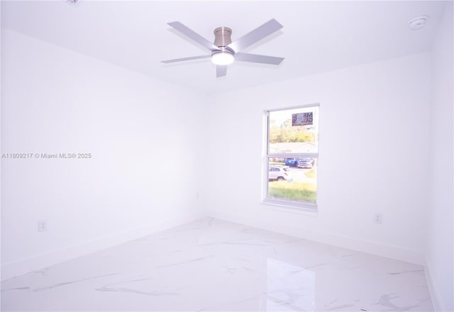 1023 Pilgrim, Lehigh Acres, FL 33974 - unfurnished room featuring baseboards, marble finish flooring, and a ceiling fan
