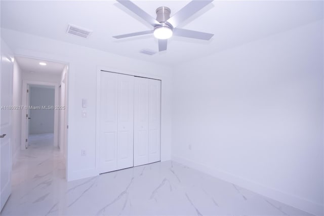 1023 Pilgrim, Lehigh Acres, FL 33974 - unfurnished bedroom with light marble finish flooring, baseboards, recessed lighting, a closet, and a ceiling fan