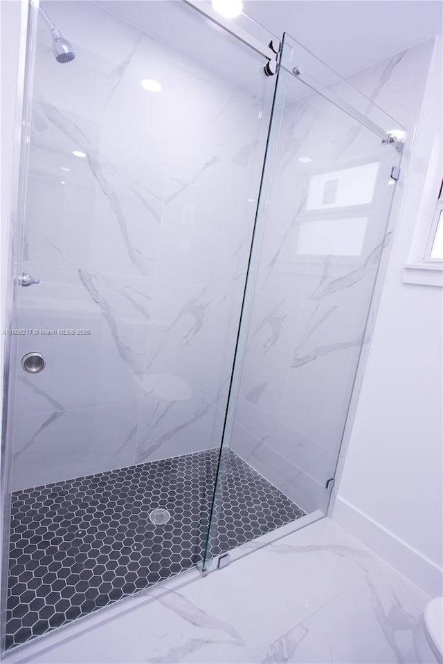 1023 Pilgrim, Lehigh Acres, FL 33974 - full bath featuring a marble finish shower, marble look tiles, and toilet