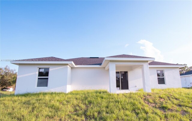 1023 Pilgrim, Lehigh Acres, FL 33974 - back of property with stucco siding