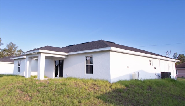 1023 Pilgrim, Lehigh Acres, FL 33974 - view of home's exterior featuring stucco siding and cooling unit