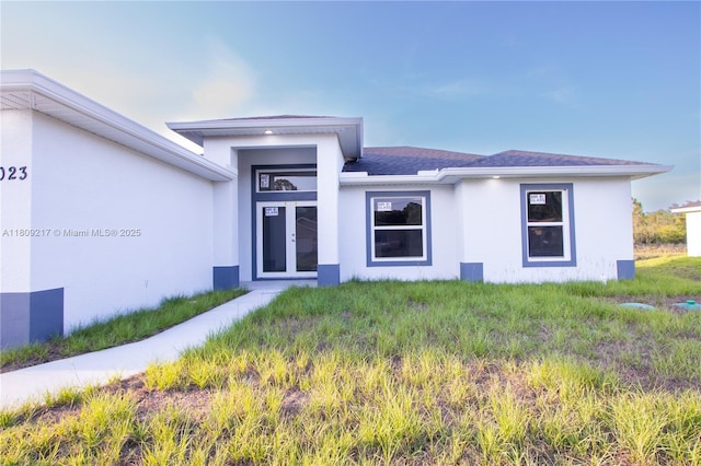 1023 Pilgrim, Lehigh Acres, FL 33974 - view of front of house featuring stucco siding