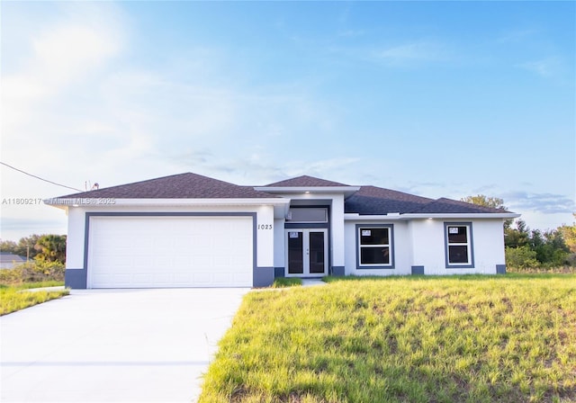 1023 Pilgrim, Lehigh Acres, FL 33974 - prairie-style home featuring stucco siding, french doors, concrete driveway, and a garage