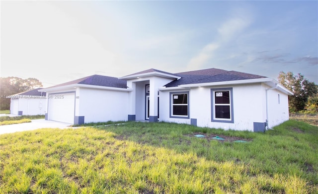 1023 Pilgrim, Lehigh Acres, FL 33974 - ranch-style house featuring stucco siding, an attached garage, driveway, and a front yard